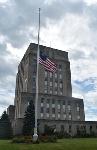 U.S. flag flying at half-staff outside the Racine County Courthouse for county executive